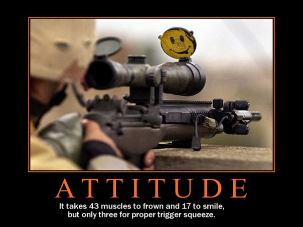 Rifle with scope and a smiley face target on top. Person in balaclava aiming