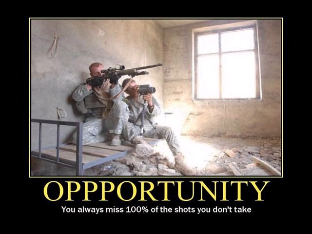 Two soldiers aiming rifles from a bed frame in a room