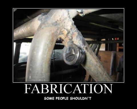 1988 Ford Bronco - This image shows a close-up of a roll cage with a socket wrench attached, highlighting questionable fabrication work.
