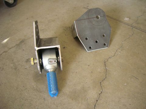 1996 Ford Bronco - Custom radius arm mount components shown on a concrete floor.