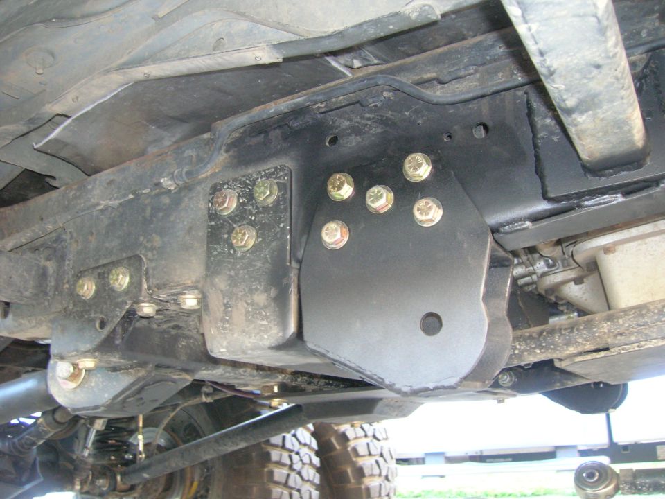 Modified radius arm mount on vehicle undercarriage