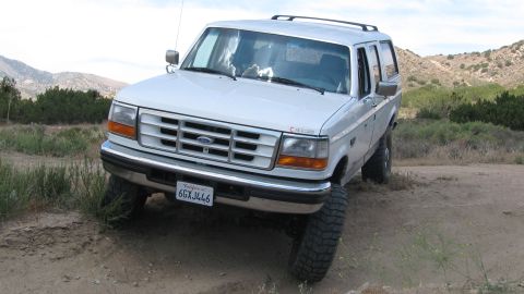 1996 Ford C-350 (Centurion Conversions) - White 1996 Ford C-350 (Centurion Conversions) SUV on an off-road trail.
