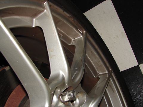 1992 Ford Taurus - Close-up of a silver alloy car wheel and tire assembly.