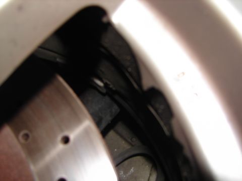 1992 Ford Taurus - A detailed view of a vehicle's braking system and wheel well components is visible.