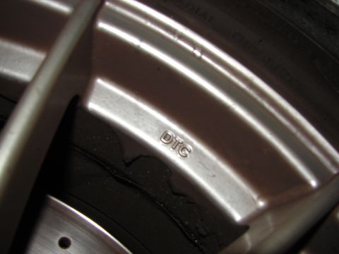 1992 Ford Taurus - This image shows a close-up of a car wheel with the marking "DTC" visible.