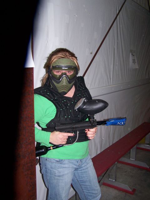 1986 Ford Bronco - A person is geared up and ready to play paintball, holding their marker.
