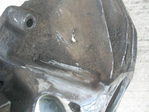 1984 Ford Bronco - Notice that light spot next to the rib? That is a hole in the casting. J U N K that I am expected to work with.