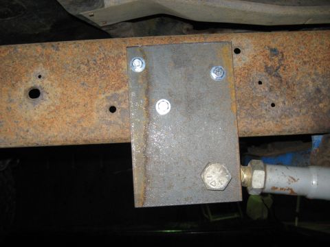1978 Ford Bronco - A custom metal plate is attached to the vehicle's frame, showing signs of rust and modification.