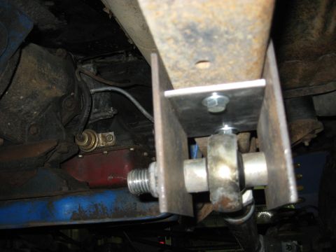 1978 Ford Bronco - Close-up view of the undercarriage, showing suspension components and drivetrain parts.