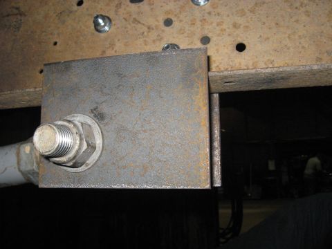 1978 Ford Bronco - This image shows a close-up of a custom metal bracket attached to a vehicle's frame, likely for modification or repair.