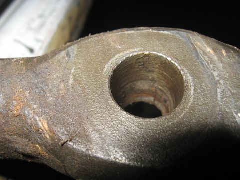 1978 Ford Bronco - Detail of a worn metal part with a threaded bore, likely from machinery or a vehicle.