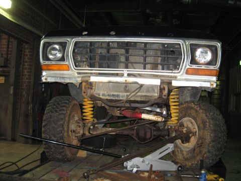1978 Ford Bronco - Front view of a 1978 Ford Bronco showing its grille, headlights, and lifted suspension.