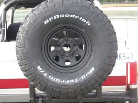 1991 Ford Bronco - Spare tire with BFGoodrich Mud-Terrain T/A branding is mounted on the rear of a vehicle.