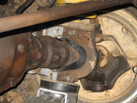 1978 Ford Bronco - Undercarriage view of a vehicle's front axle and suspension system, showing various mechanical components.