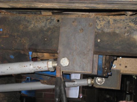 1978 Ford Bronco - This image shows a close-up view of a modified suspension component attached to the vehicle's frame.