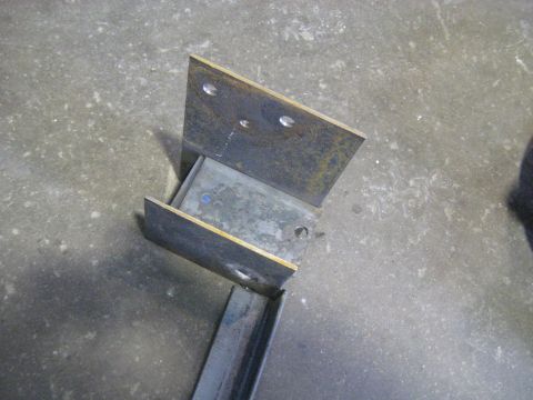1978 Ford Bronco - Assembly of metal brackets with drilled holes, likely for construction or repair purposes.