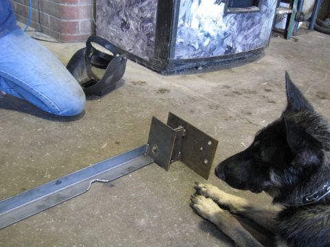 1978 Ford Bronco - Metal bracket and dog in a workshop setting.