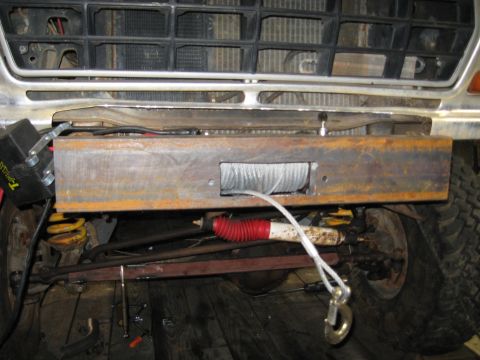 1978 Ford Bronco - A custom winch bumper with a winch and tow hook is installed on the front of a vehicle. The registry claims it is a 1978 Ford Bronco, but t…