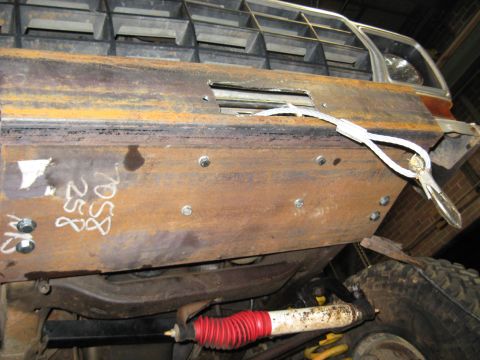 1978 Ford Bronco - A close-up view of a heavily modified vehicle's front end, showing a custom bumper and part of the grille.