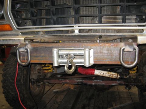 1978 Ford Bronco - Front view of a 1978 Ford Bronco a custom bumper with a winch and D-ring tow hooks.