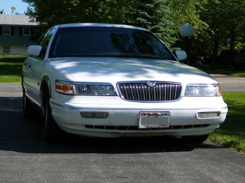 1997 Mercury Grand Marquis - Front view of a white 1997 Mercury Grand Marquis parked on a driveway.