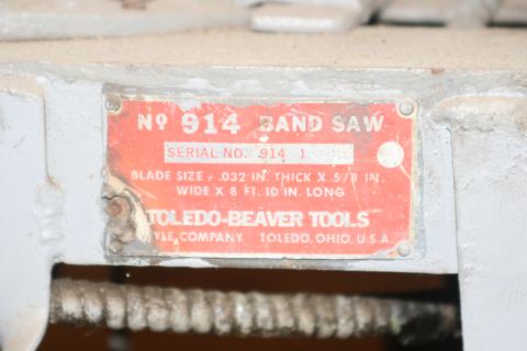 1990 Ford Bronco - A close-up view of a bandsaw's identification plate, indicating model number 914 and manufacturer Toledo-Beaver Tools.