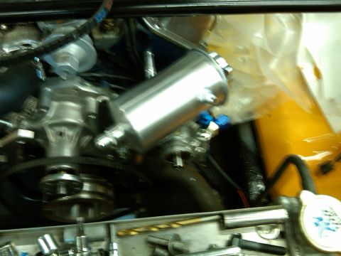1978 Ford Mustang II - Polished aluminum power steering reservoir with blue fittings visible in the engine bay.