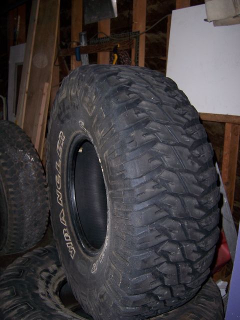 1991 Ford Bronco - Close-up of a Goodyear Wrangler tire, likely for an off-road vehicle.