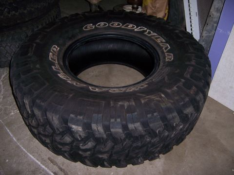 1991 Ford Bronco - A single Goodyear Wrangler tire is visible, with its tread pattern clearly displayed.