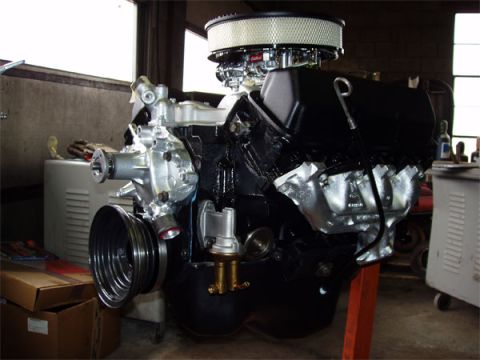 1979 Ford Bronco - Engine assembly with chrome air cleaner and visible water pump, likely a Ford 400 cid.