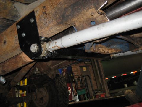 1978 Ford Bronco - Undercarriage view shows a modified suspension system with new hardware installed on a vehicle.