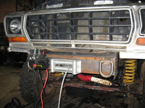 1978 Ford Bronco - Front view of a 1978 Ford Bronco, showing a winch and custom bumper modifications.