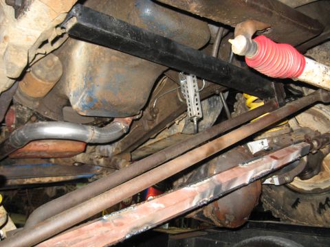 1978 Ford Bronco - Close-up of vehicle undercarriage with focus on suspension and drivetrain parts.