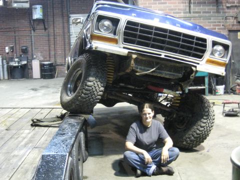 1978 Ford Bronco - Modified 1978 Ford Bronco on a trailer in a garage setting.