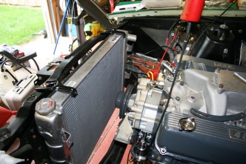 1971 Ford Ranchero - The engine bay of a vehicle is shown, a large radiator and various engine parts. A website watermark is present in the lower right corner.