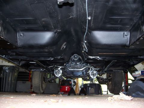 1971 Ford Ranchero - The underside of a vehicle is shown, with the drivetrain and suspension components visible.
