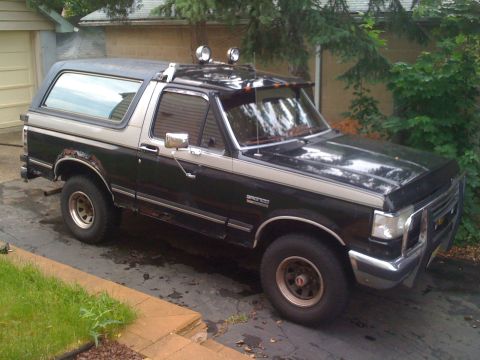 1988 Ford Bronco - This 1988 Ford Bronco features a two-tone paint scheme and auxiliary lights mounted on the roof rack.
