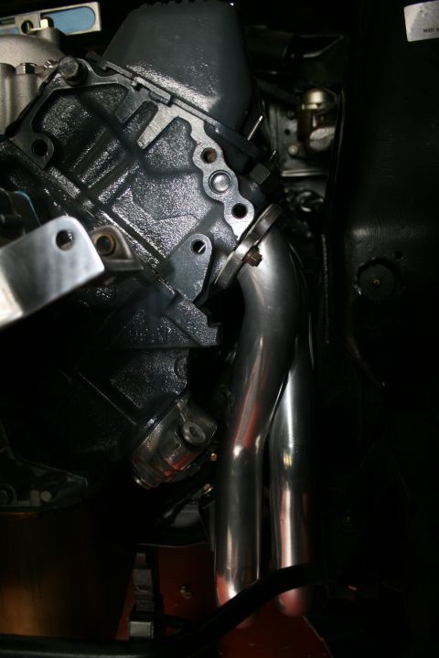 1971 Ford Ranchero - Close-up of an engine block and exhaust headers, with visible text from Supermotors.net.