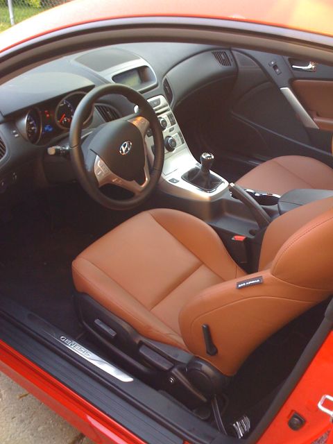 2010 Hyundai Genesis - Interior of a 2010 Hyundai Genesis coupe with tan leather seats and manual transmission.