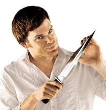 1989 Ford Bronco - A man in a white shirt sharpens a large, shiny knife against his thumb.