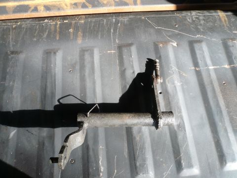 1975 Ford Ranchero - A metal bracket is shown in detail, its form and mounting points visible against a textured background.