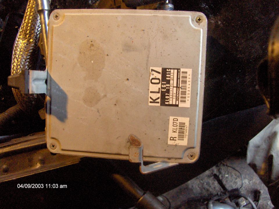 Engine control unit with KL07 and KL07D labels. Some smudges on the casing