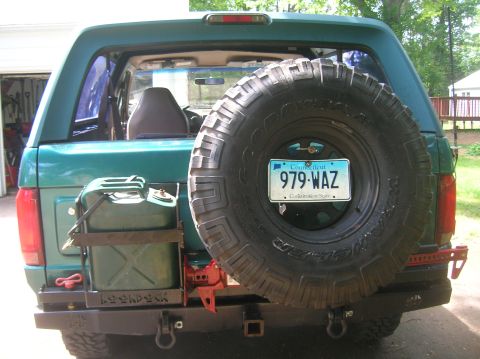 1996 Ford Bronco - This 1996 Ford Bronco features a rear-mounted spare tire, a jerry can holder, and a custom bumper.