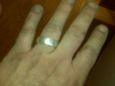 1995 Ford Bronco - A silver band ring is worn on a hand, with a website URL in the corner.