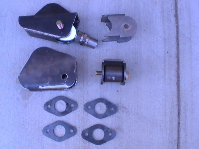 Custom fabricated suspension components, including a trailing arm with a heim joint, a separate bracket, a bushing, and four flange gaskets