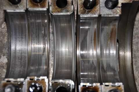 1996 Ford Bronco - Close-up of worn engine bearings, indicating potential internal engine damage.