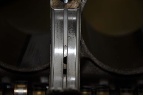 1996 Ford Bronco - This is a close-up view of an engine's crankshaft bearing, revealing signs of wear and tear.
