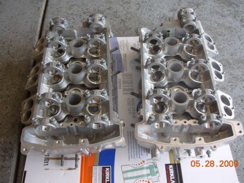 1995 Ford Taurus - Two engine cylinder heads are shown, resting on a box with a date stamp of 05.28.2009.