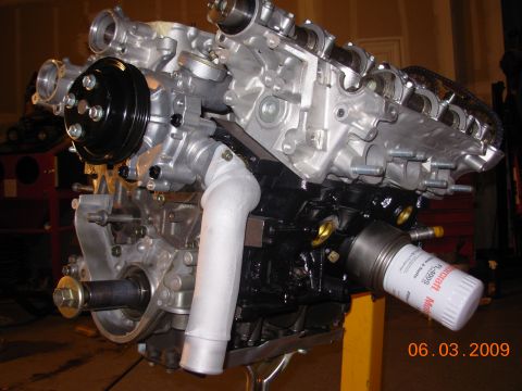 1995 Ford Taurus - Engine assembly with visible oil filter and date stamp from 2009.