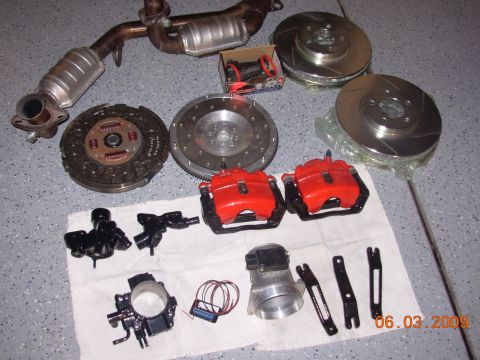 1995 Ford Taurus - Various automotive performance parts are displayed, suggesting a vehicle upgrade or repair project.